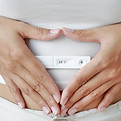 Hands holding pregnancy test representing hope