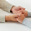 Supportive hands representing emotional care
